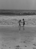 Boy and girl playing on beach Poster Print - Item # VARSAL255422727