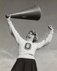 Low angle view of a female cheerleader holding a megaphone and shouting Poster Print - Item # VARSAL25518596