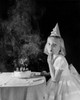 Portrait of a girl sitting in front of a birthday cake Poster Print - Item # VARSAL2553185
