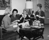 Four young women sitting together drinking tea Poster Print - Item # VARSAL25542603