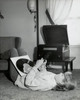 Side profile of a teenage girl lying on a carpet and holding records  1965 Poster Print - Item # VARSAL2552592A