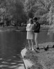 Young couple standing by lake Poster Print - Item # VARSAL255422732