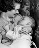 Mother holding sleeping child Poster Print - Item # VARSAL2559793
