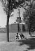 Three students sitting on grass outside university building Poster Print - Item # VARSAL255422984