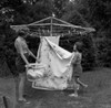Two girls doing laundry in garden Poster Print - Item # VARSAL255416411