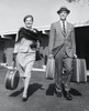 Mature couple carrying their luggage Poster Print - Item # VARSAL2555928
