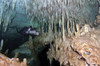 Diver using side mount gear in cave in Mexico Poster Print - Item # VARPSTKWD400137U