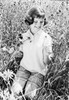 Girl with flowers on meadow Poster Print - Item # VARSAL255416967