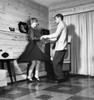 Side profile of a young couple dancing in a living room Poster Print - Item # VARSAL25511343