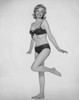 Portrait of young woman in underwear standing on one leg Poster Print - Item # VARSAL25542314
