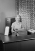 Secretary looking at camera and smiling Poster Print