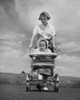 Young woman pushing her baby in a baby stroller Poster Print - Item # VARSAL2559752