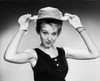 Portrait of a young woman holding a hat Poster Print - Item # VARSAL25541902
