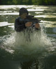 Special operations forces soldier emerges from water armed with a Steyr AUG assault rifle Poster Print - Item # VARPSTTWE300053M