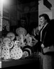 Young woman watching china at window display Poster Print - Item # VARSAL255422151