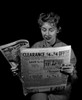 Mature woman reading newspaper Poster Print - Item # VARSAL255416698