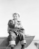 Boy sitting on boat smiling Poster Print - Item # VARSAL255424461
