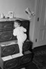 Girl playing on drawer chest Poster Print - Item # VARSAL255423022