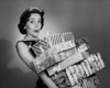 Portrait of a young woman holding a stack of Christmas present Poster Print - Item # VARSAL25539877