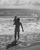 Rear view of a father carrying his son on the beach Poster Print - Item # VARSAL25519680