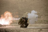 U.S. Marine watches a U.S. Contractor fire a HE fragmentation round from the RPG-7 rocket-propelled grenade launcher in a wadi near Kunduz, Afghanistan Poster Print - Item # VARPSTTMO100388M