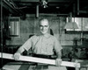 Portrait of manual worker holding level in workshop Poster Print - Item # VARSAL255416332