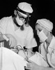Patient getting treatment from two oral surgeons Poster Print - Item # VARSAL255104