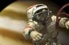 A cosmonaut floats in space above a large alien planet. Poster Print - Item # VARPSTMRC200126S
