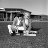 Students couple sitting on grass and learning Poster Print - Item # VARSAL255416375