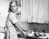 Young woman washing dishes in kitchen Poster Print - Item # VARSAL25541818