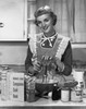 Portrait of a young woman preparing food in the kitchen and smiling Poster Print - Item # VARSAL2555847