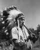 Tribal man playing a flute Poster Print - Item # VARSAL25591490