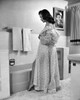 Side profile of a young woman taking off her robe Poster Print - Item # VARSAL25527296