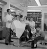 Mid adult man receiving beauty treatment in a hair salon Poster Print - Item # VARSAL2557864