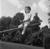 Boy sitting on seesaw and shouting Poster Print - Item # VARSAL255420847A