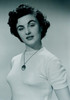 Studio portrait of young woman smiling Poster Print - Item # VARSAL255417319