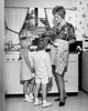 Mother standing with her children in the kitchen Poster Print - Item # VARSAL25519933