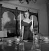 Portrait of a young woman standing near a dining table Poster Print - Item # VARSAL25541910