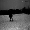 Man with umbrella walking on snow covered road Poster Print - Item # VARSAL25515113