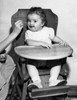 Baby feeding in high chair Poster Print - Item # VARSAL2559733