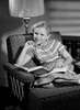 Girl sitting on armchair and reading book Poster Print - Item # VARSAL255418611