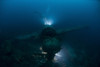 Japanese Navy Seaplane wreck lit by HMI lights with diver hovering above, Palau, Micronesia Poster Print - Item # VARPSTMME400622U