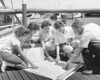 Parents and their children looking at a map on a pier Poster Print - Item # VARSAL25523362