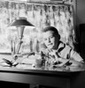 Boy sitting at desk and making model plane Poster Print - Item # VARSAL255418603B