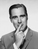 Portrait of a businessman with his finger on his lips Poster Print - Item # VARSAL25512032C