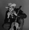 Young country musician playing harmonica Poster Print - Item # VARSAL255419010