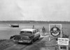 High angle view of a man standing near a car on the riverbank  Welaka  St. John's River  Florida  USA Poster Print - Item # VARSAL25540709