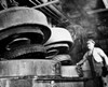 Low angle view of a male worker working in a tire factory Poster Print - Item # VARSAL25537995