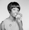 Young woman talking on landline phone Poster Print - Item # VARSAL255418559