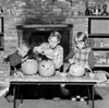 Girl and two boys preparing Jack O' Lantern for Halloween Poster Print - Item # VARSAL255418591